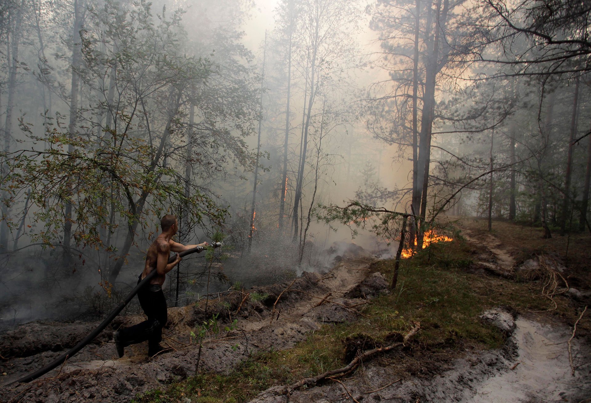 A firefighter tried to stop a forest fire near the village of Verkhnyaya Vereya in Nizhny Novgorod region, some 255 miles east of Moscow, in 2010. Nearly 600 separate blazes were burning nationwide, mainly across western Russia. Hundreds of forest and peat bog fires had ignited amid the country's most intense heat wave in 130 years of record-keeping.