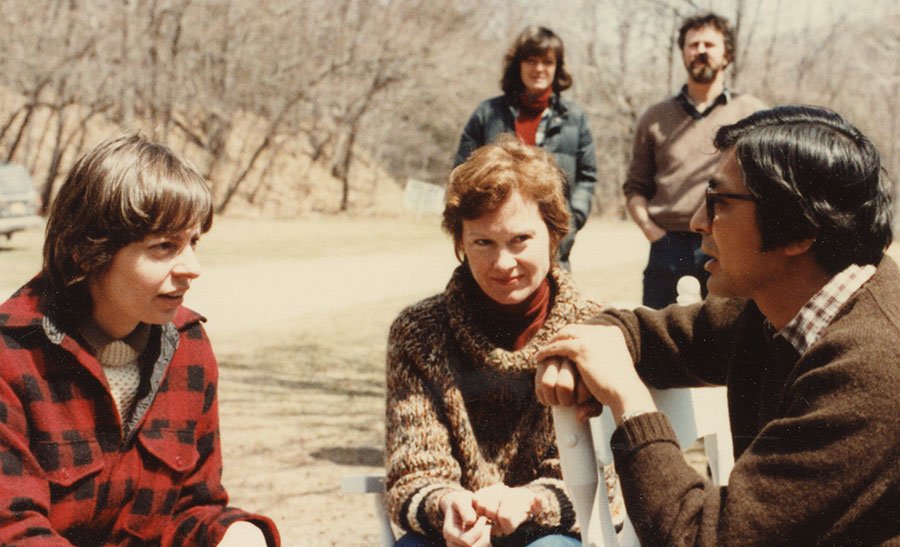 NRDC staff sitting and talking outdoors.