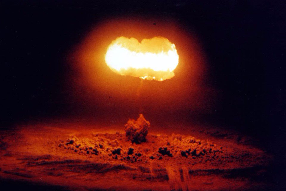 The mushroom cloud from a 19 kiloton nuclear device that was exploded from a balloon over the Nevada Test Site during a weapons test in 1957.